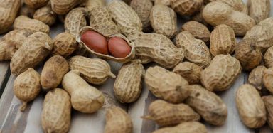 Peanuts on a wooden table.